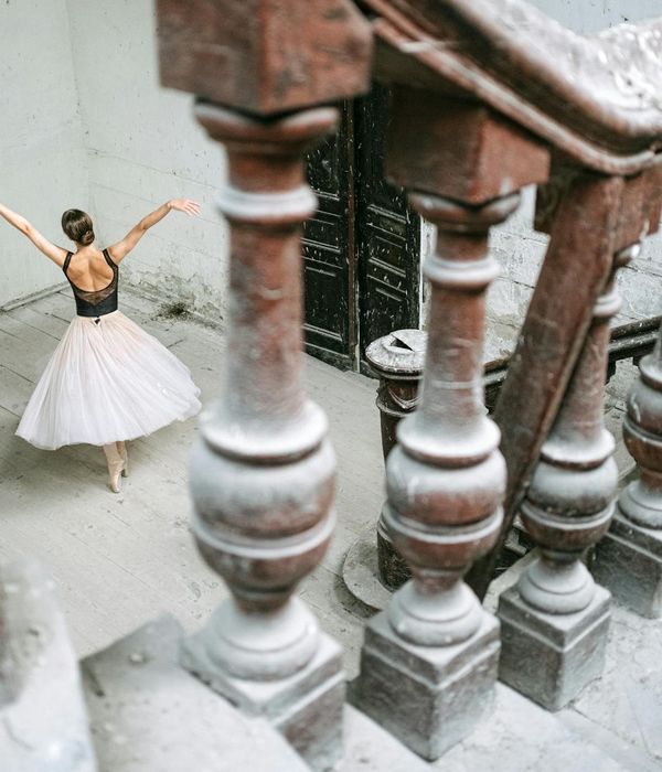 Person performing a graceful stretching pose.