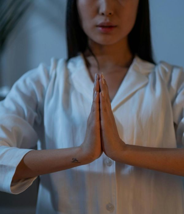 Woman in a calm state meditating with indigo colors.